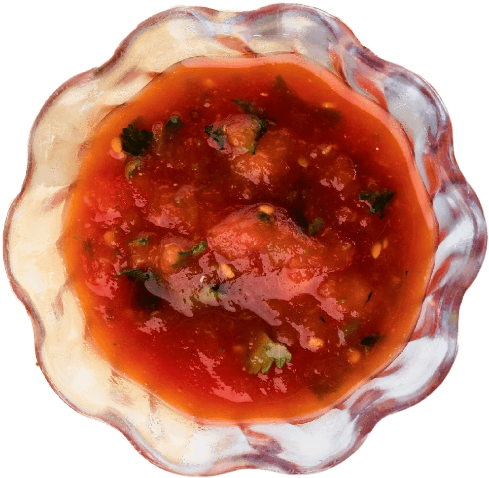A bowl of salsa against a transparent background.
